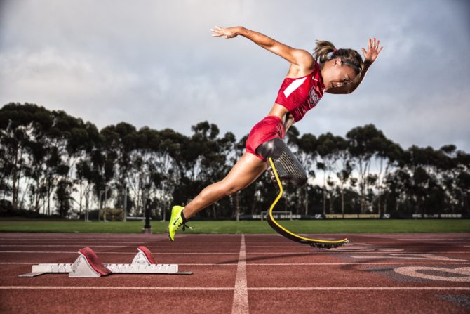 Scout Bassett a Paralympian in track and field. Image of Scout on a track starting off a race.